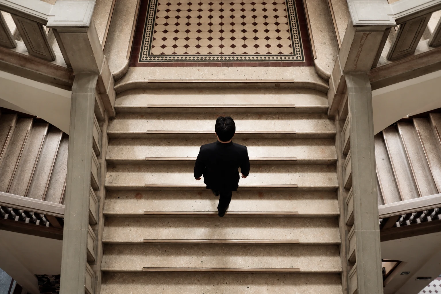 Sungwook Kim walking up a stone staircase